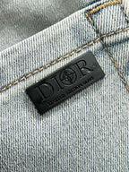 Light blue denim jeans interior brand label patch on stitched seam