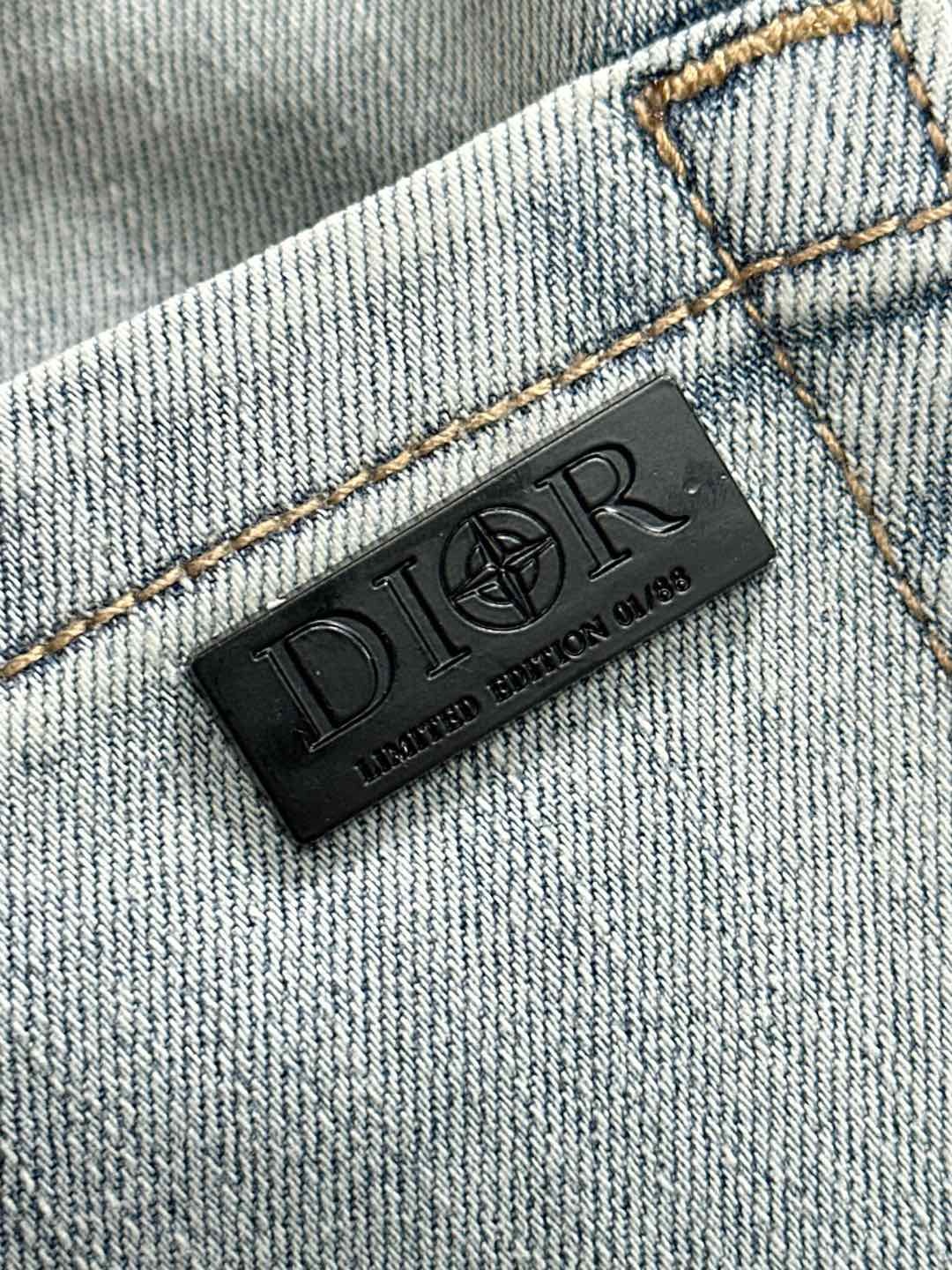 Light blue denim jeans interior brand label patch on stitched seam