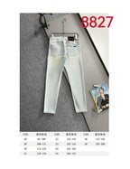 Light blue denim pants with size chart below on display