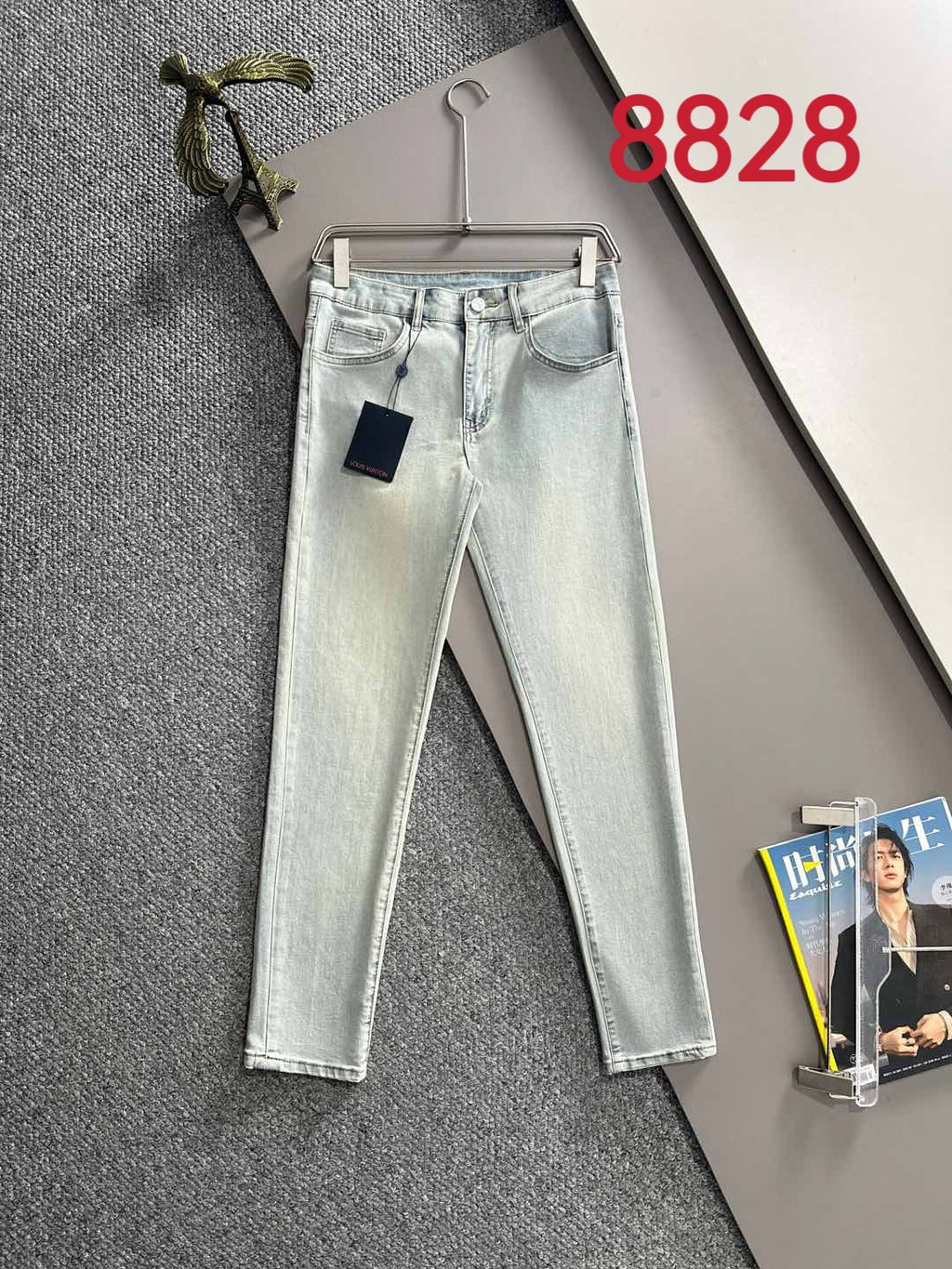 Light-wash denim jeans with front pockets, belt loops and straight legs