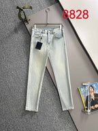 Light-wash denim jeans with front pockets, belt loops and straight legs