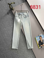 Givenchy light-wash jeans on hanger, full front view