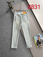 Givenchy light-wash jeans on hanger, front view