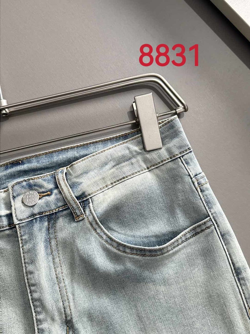Givenchy light-wash jeans, close-up of back waistband and pocket