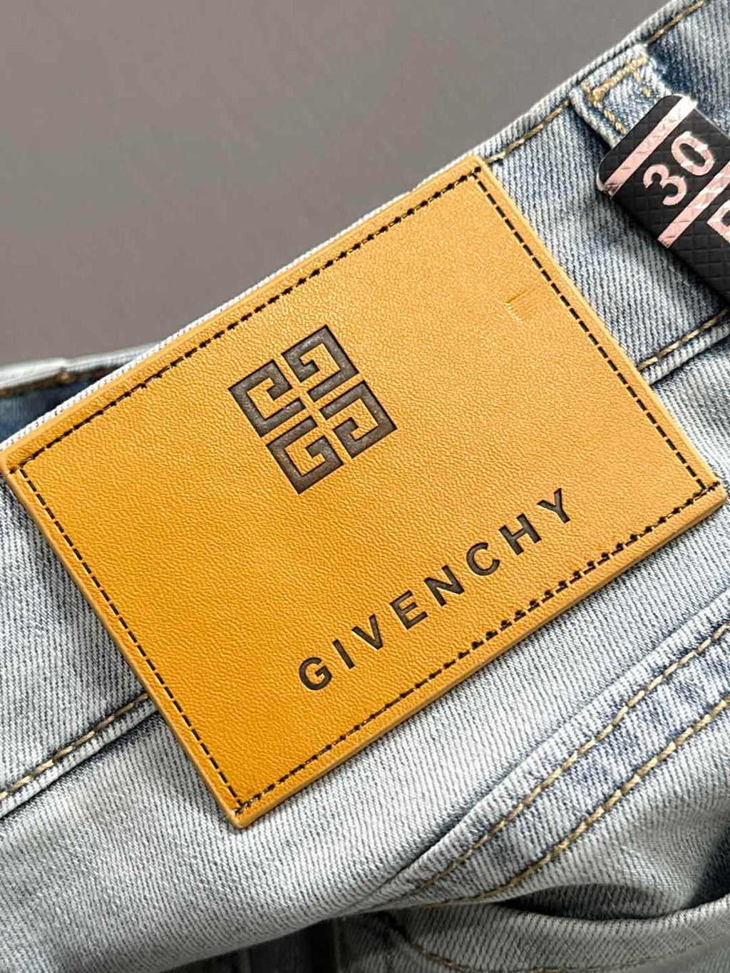 Givenchy jeans leather logo patch on waistband