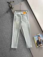 Givenchy light-wash jeans on hanger, front view