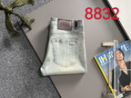 Light-wash Dior denim pants, back pockets and waistband brand patch