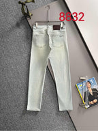 Light-wash Dior denim pants on hanger, straight legs with back pockets
