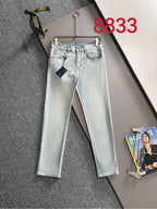 Light blue denim pants with belt loops and front button-and-zip closure