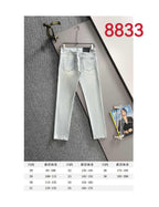 Light blue denim pants shown with size chart below