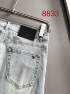 Light blue denim pants front view with back pocket and belt loops