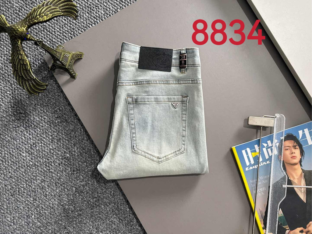 Prada light-wash denim pants folded with belt loops and back yoke