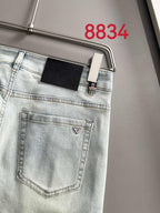 Prada light-wash denim pants with a front patch pocket and belt loops