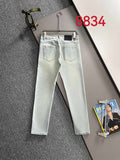 Prada light-wash denim pants with front pockets and straight legs