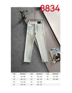 Prada light-wash denim pants on a hanger