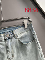 Prada light-wash denim pants with waistband tab and button closure