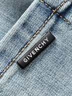 Givenchy denim jeans interior brand label on light-blue fabric