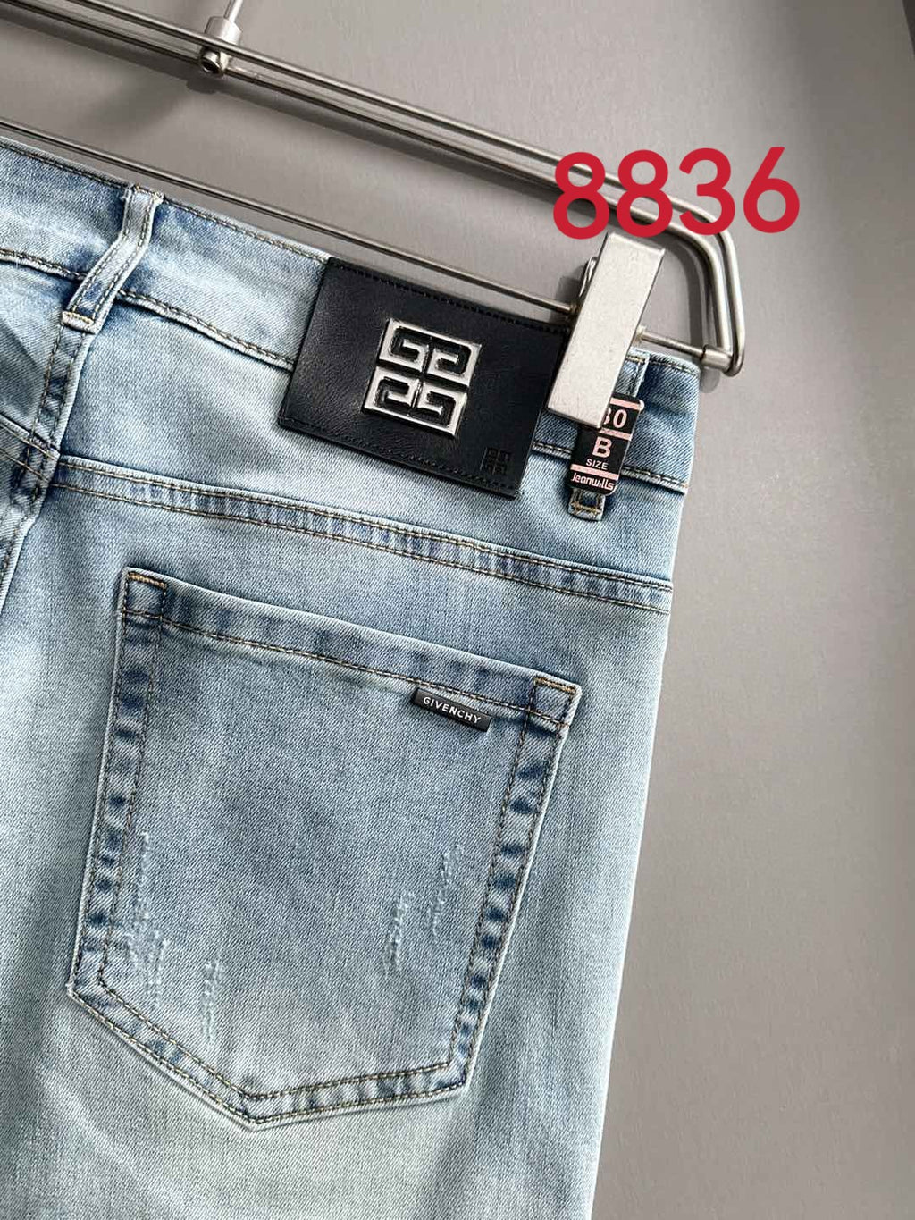 Givenchy denim jeans back pocket with Greek-key logo patch