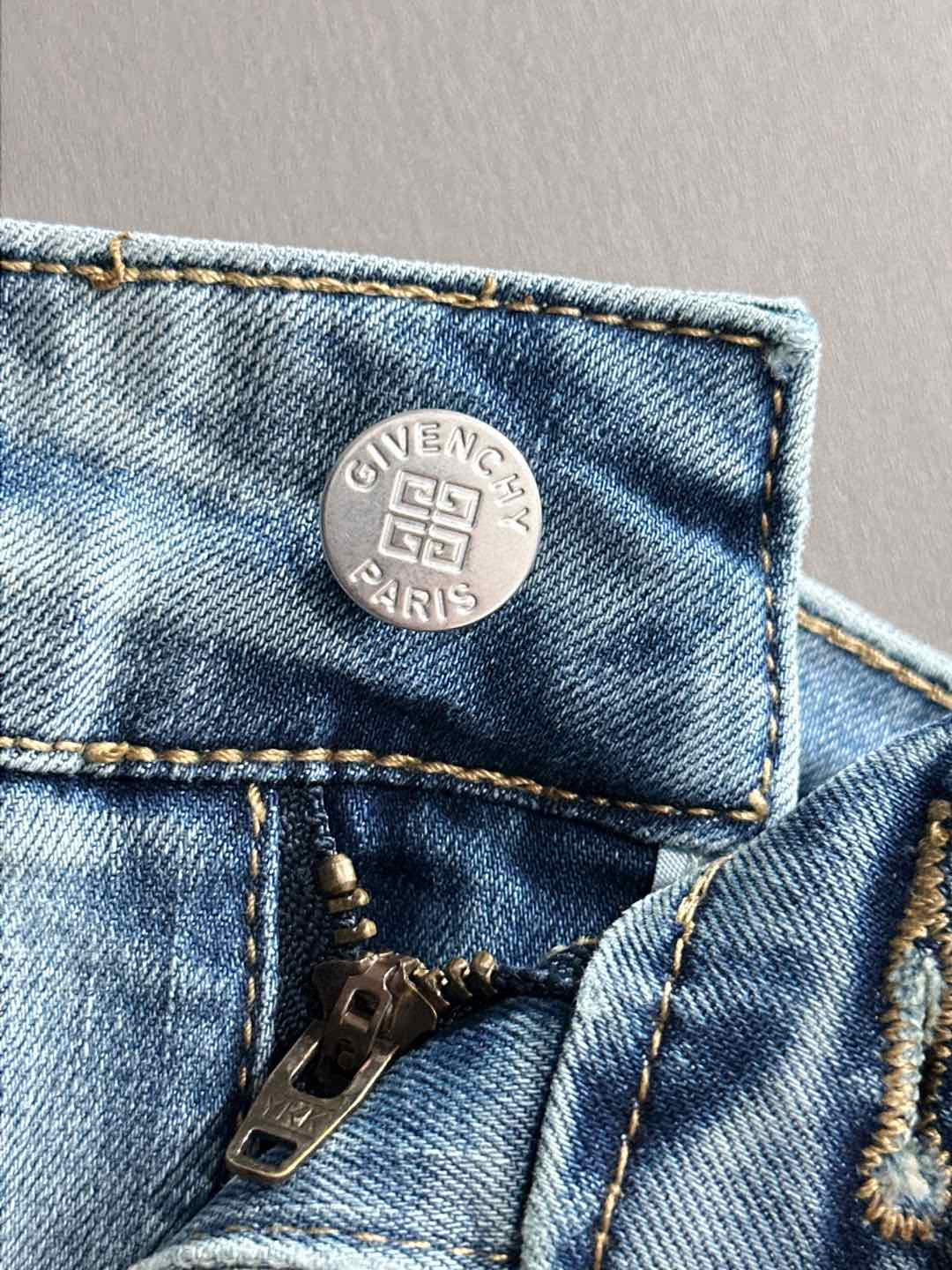 Givenchy Paris metal logo tag on denim pocket