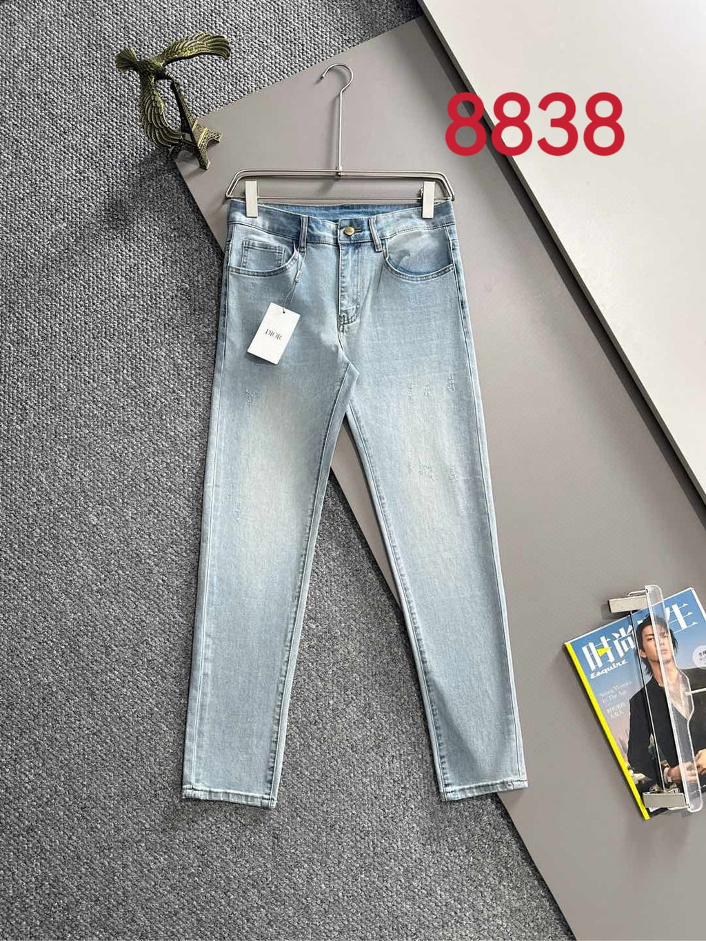 Light blue denim pants with belt loops, zipper fly, and size tag