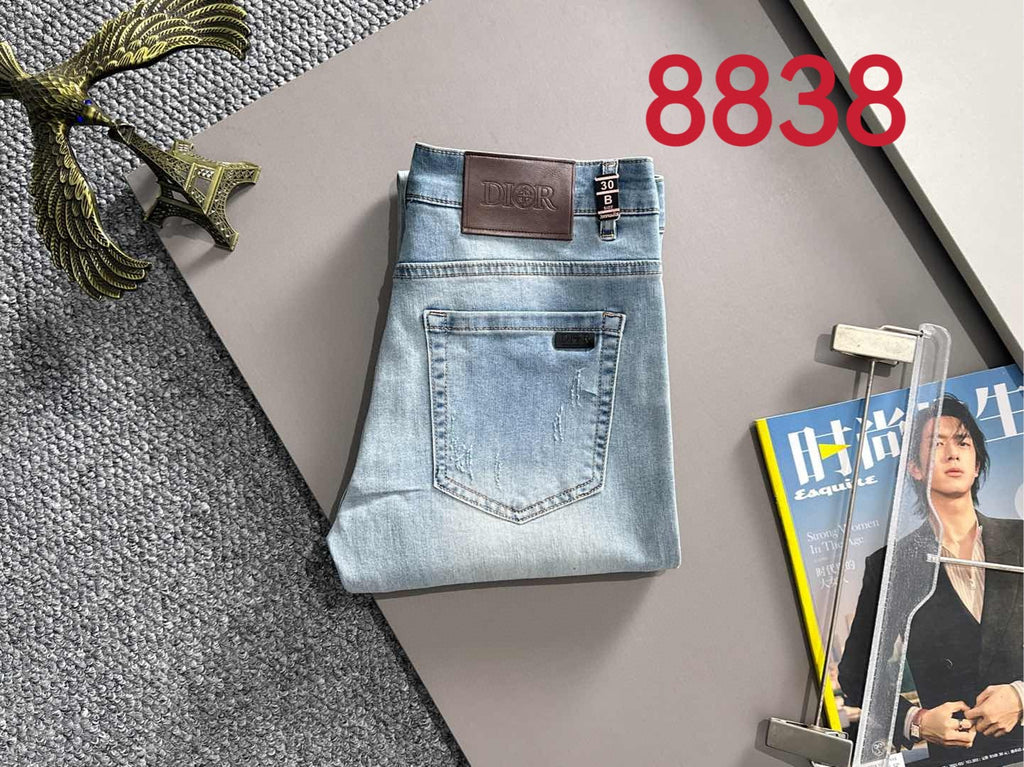 Light blue denim pants with brown leather waistband patch and front pocket