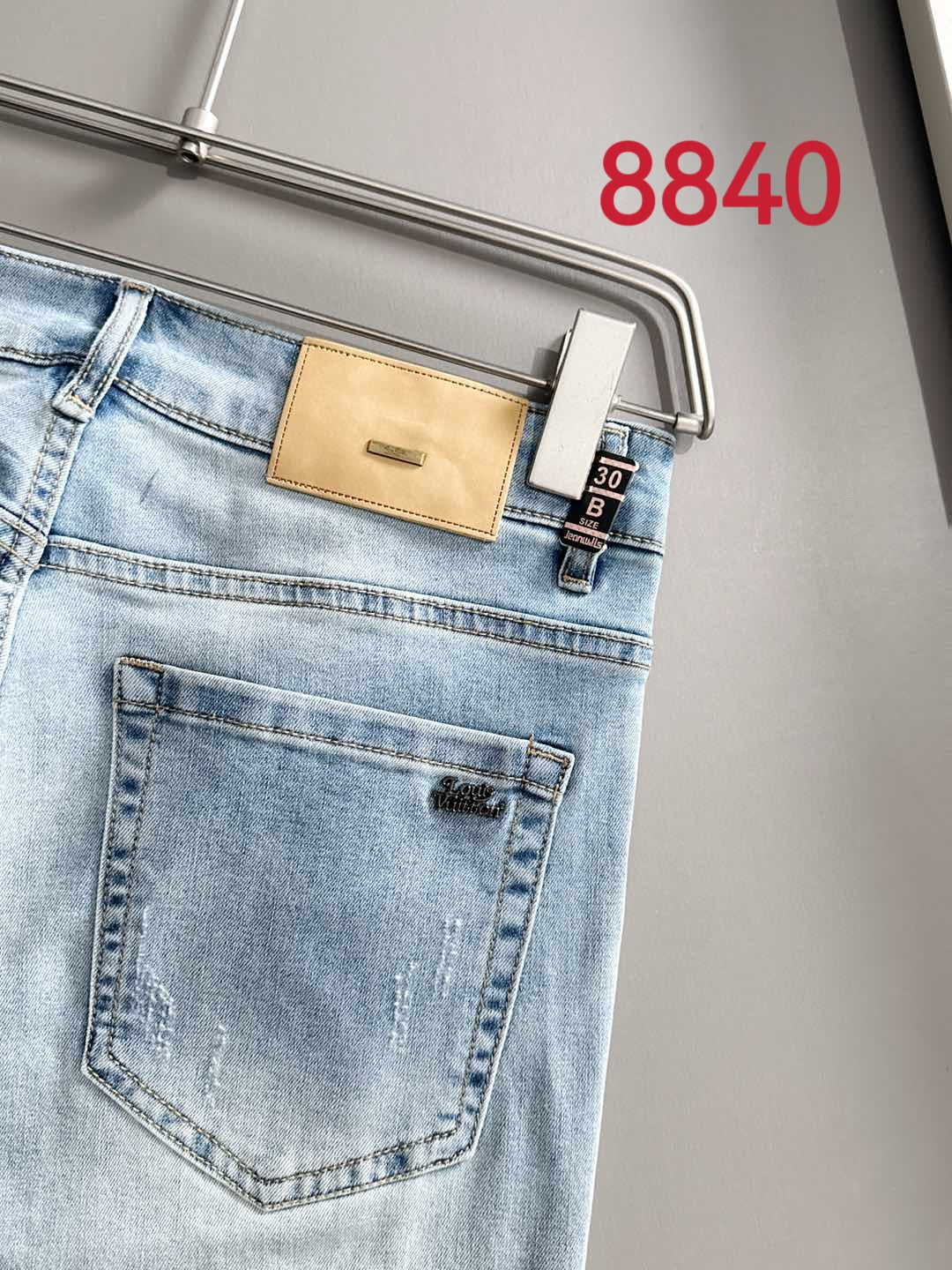 Louis Vuitton light blue denim jeans with tan back waistband patch
