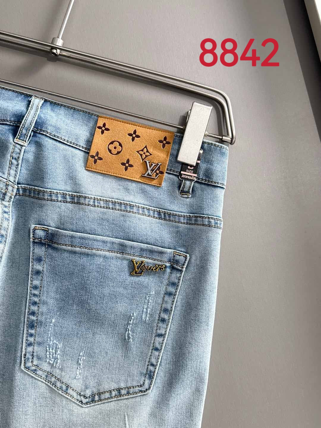 Light blue denim jeans with brown monogram waistband patch and front pocket