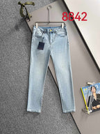 Light blue denim jeans with belt loops and front pockets, straight leg fit