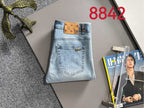 Light blue denim jeans with brown logo waistband patch and back pocket