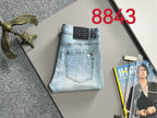 Light blue denim pants with Prada logo label and back pocket stitching.