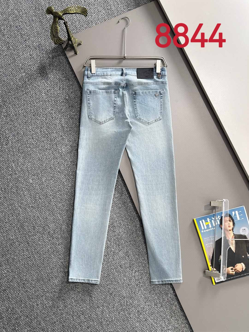 Light blue denim pants with belt loops and five-pocket design