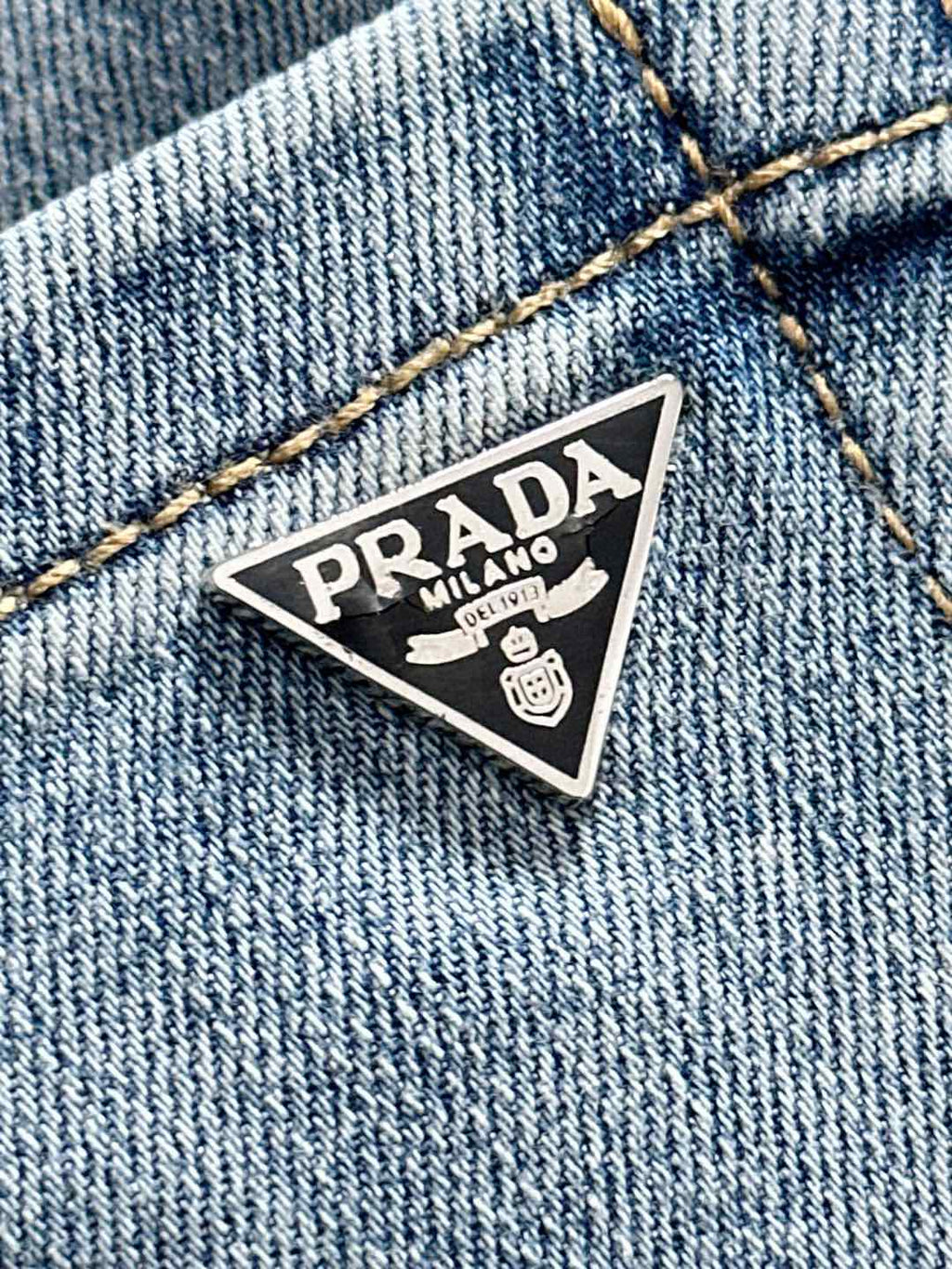 Denim fabric with PRADA Milano stitched logo patch