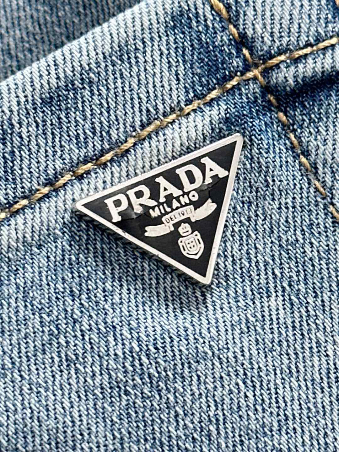 Denim fabric with PRADA Milano stitched logo patch
