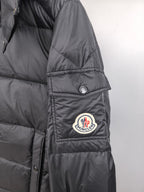 Long Moncler puffer jacket sleeve with Moncler patch and snap cuff