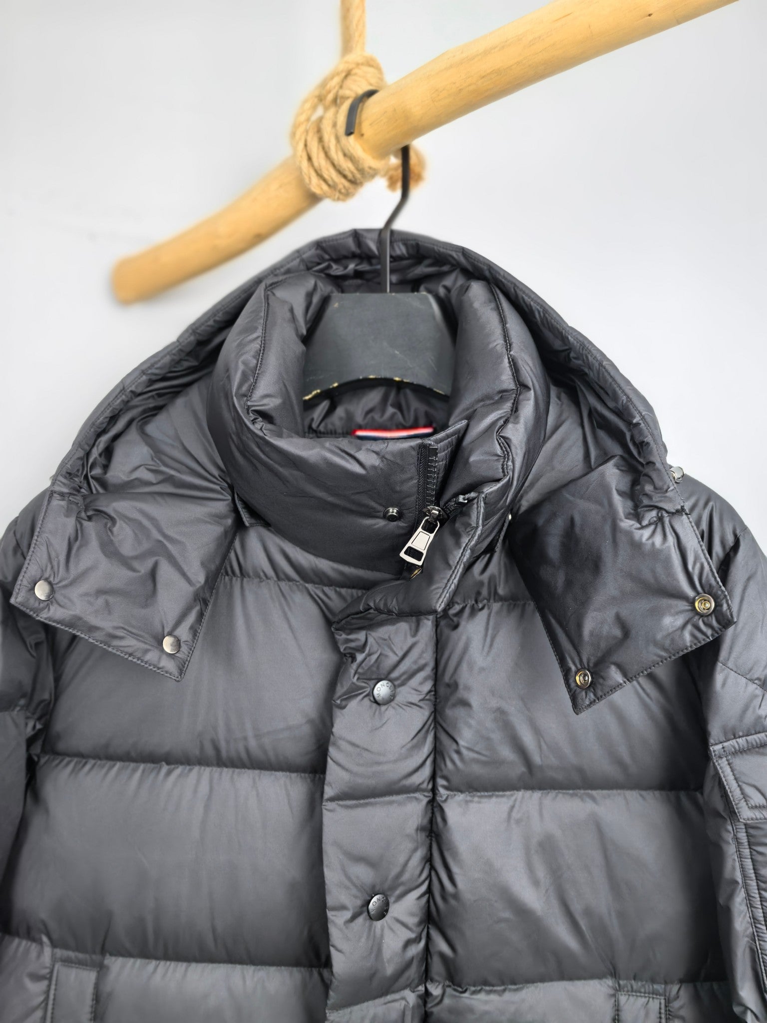 Long Moncler puffer jacket hood detail, front zipper and snap placket