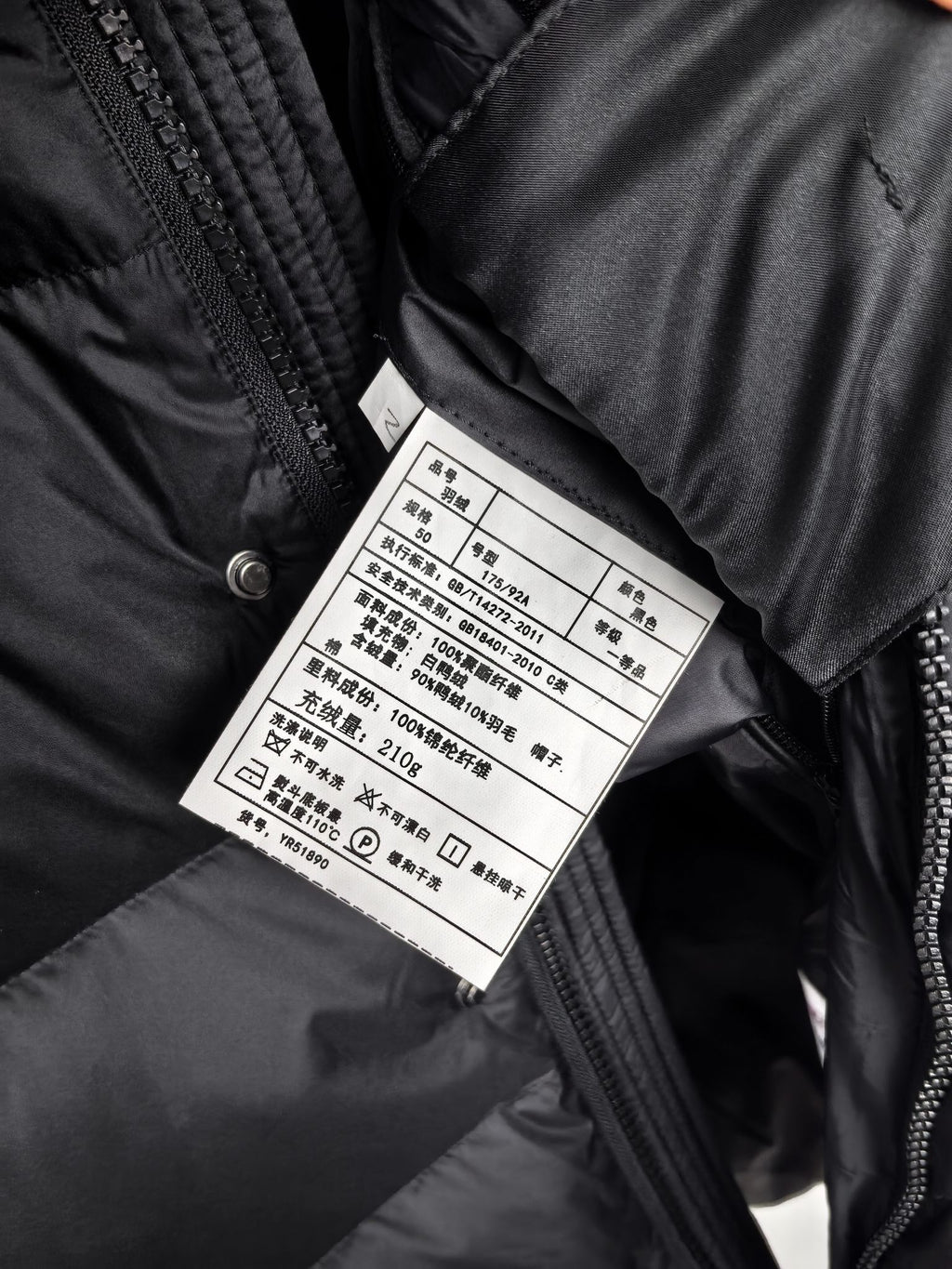 Long Moncler puffer jacket care label on inner seam