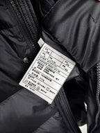 Long Moncler puffer jacket care label on inner seam
