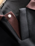 Black sweatshirt placket detail with burgundy trim and round snap