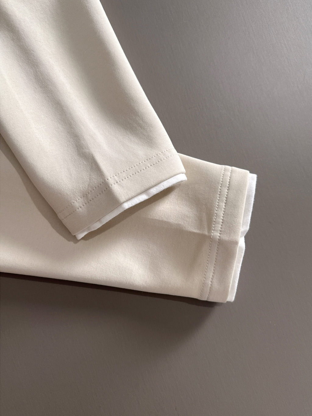 Dior long-sleeve polo shirt hem and cuff detail in light cream