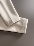 Dior long-sleeve polo shirt hem and cuff detail in light cream