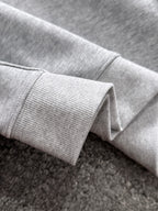 Light gray pullover sleeve cuff with ribbed knit hem