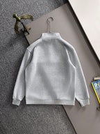 Light gray long-sleeve pullover with high neck, back view