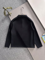 Dark long-sleeve jacket shirt with curved yoke seam, back view on hanger