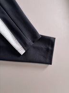 Two-tone long-sleeve shirt cuff and sleeve panel in black and grey