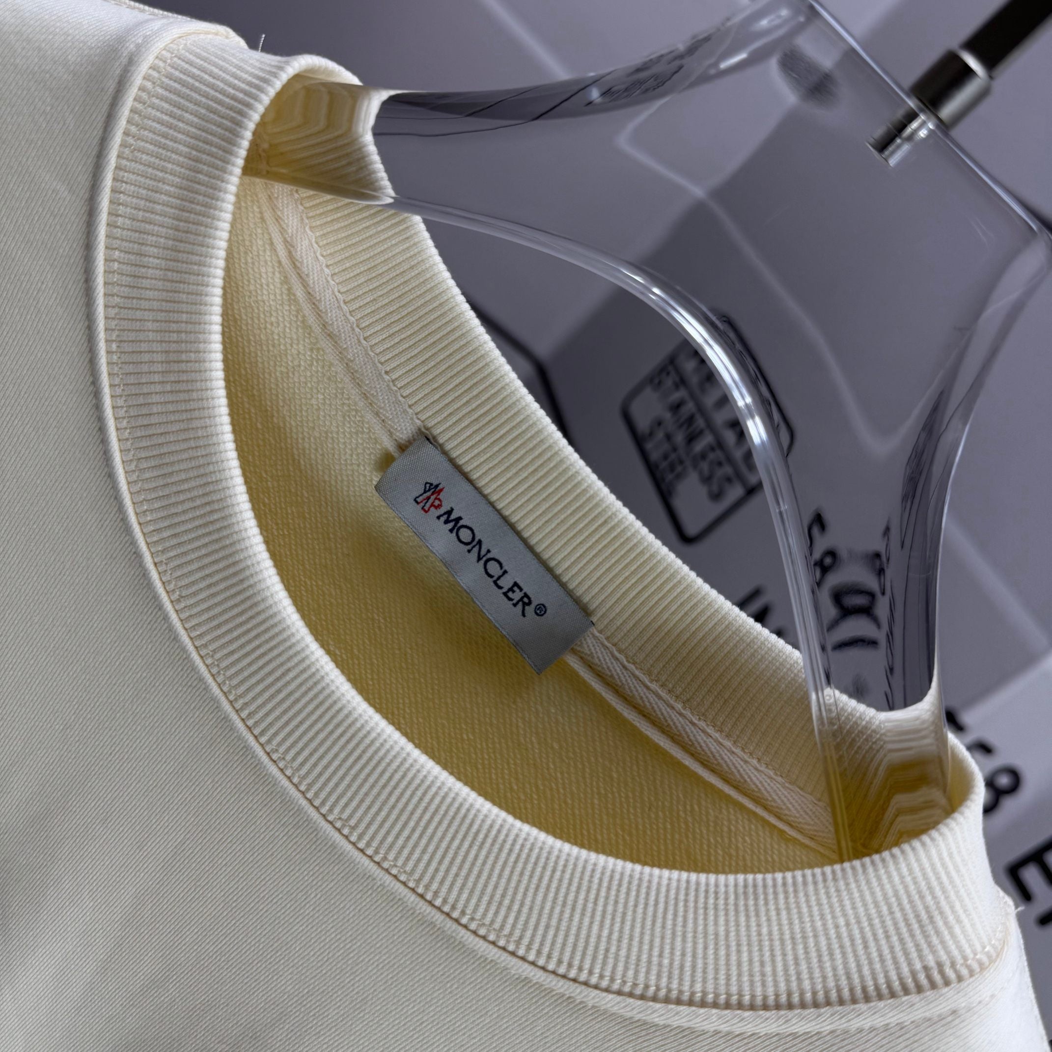 Moncler crewneck sweatshirt neckline close-up with interior brand label