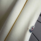 Moncler crewneck sweatshirt sleeve with small circular logo patch