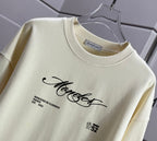 Moncler crewneck sweatshirt close-up with chest logo text graphic and printed emblem