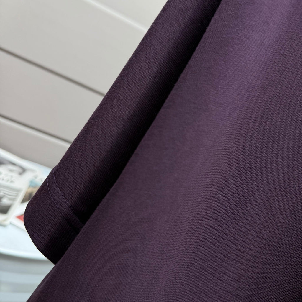 Burberry dark purple T-shirt sleeve close-up