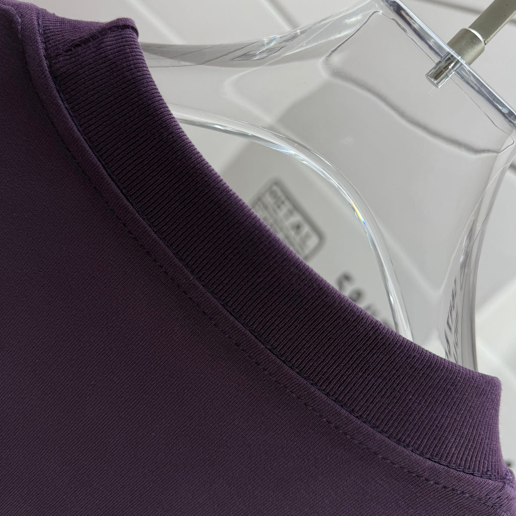 Burberry dark purple T-shirt collar detail on clear hanger