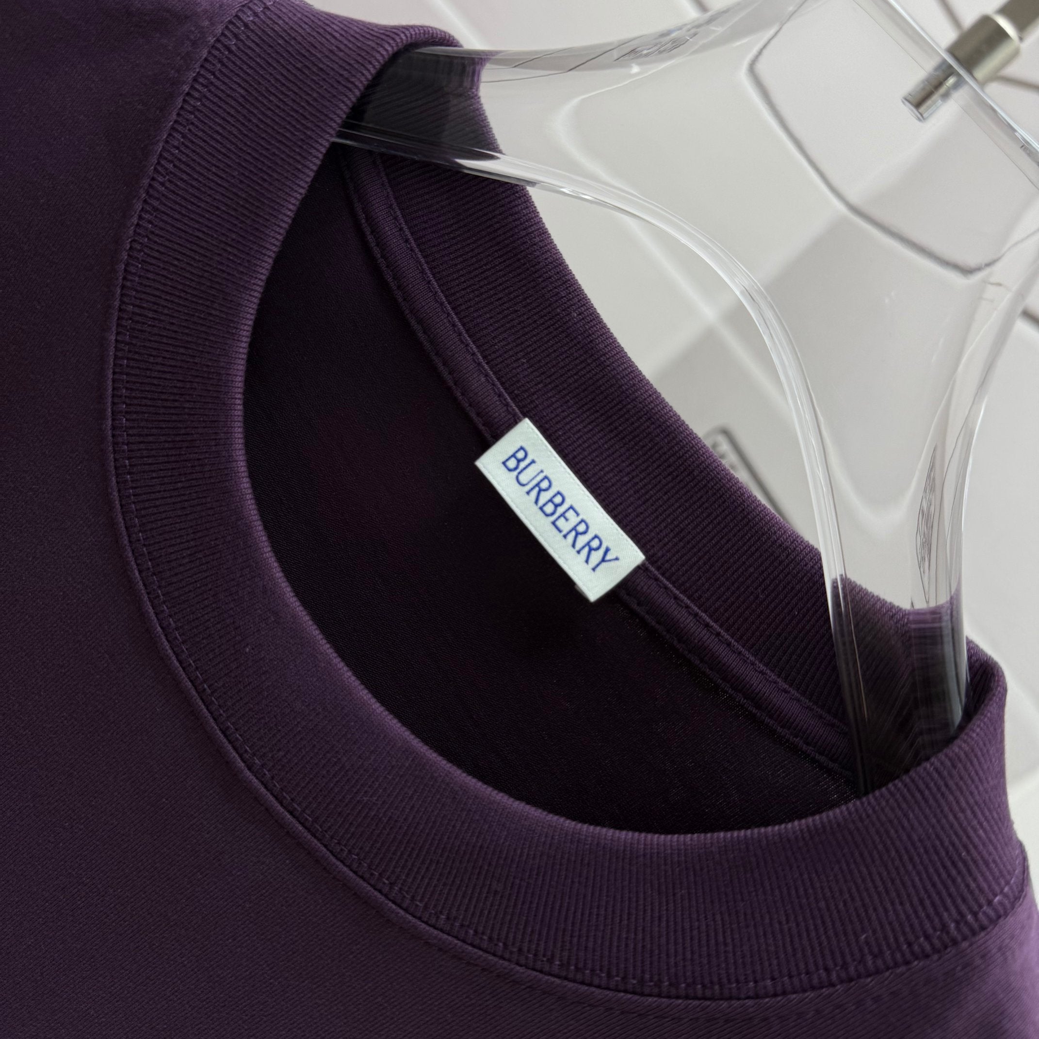 Dark purple Burberry T-shirt neckline with interior logo label